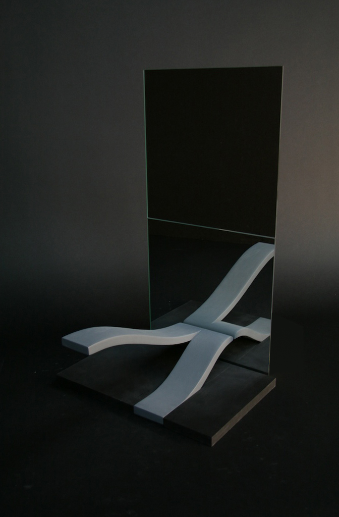 The prototype was made out of wood and painted a neutral grey as to facilitate conversation about the form within a studio review. In order to demonstrate the full effect, I created a stand for two square mirrors that a friend let me borrow.