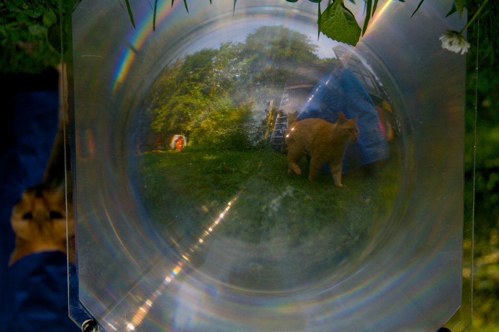 In one of the most bizarre turn of events, the lens flips the world upside down. The optics of the fresnel lens create rainbows and ghost images.