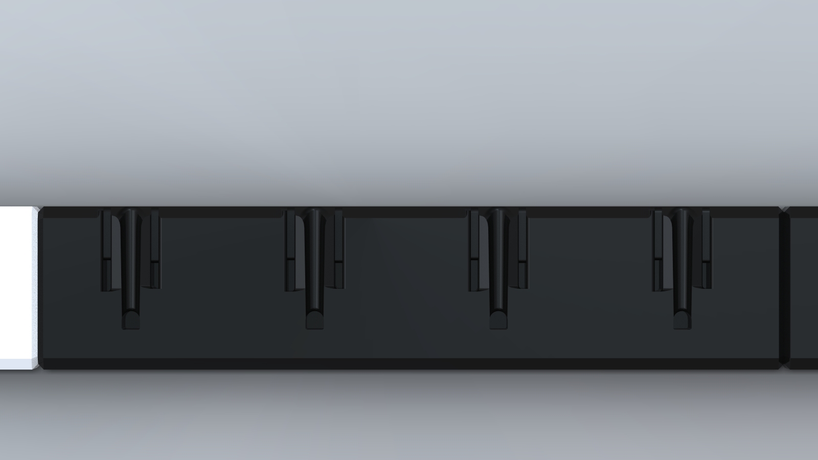The main feature of my design are molded tracks that allow the user to guide the prongs to the outlet. This was inspired by the difficulties in trying to plug appliances in when they are hidden from sight. This coincided well with the studio prompt to design a product that would benefit sighted and non-sighted users.